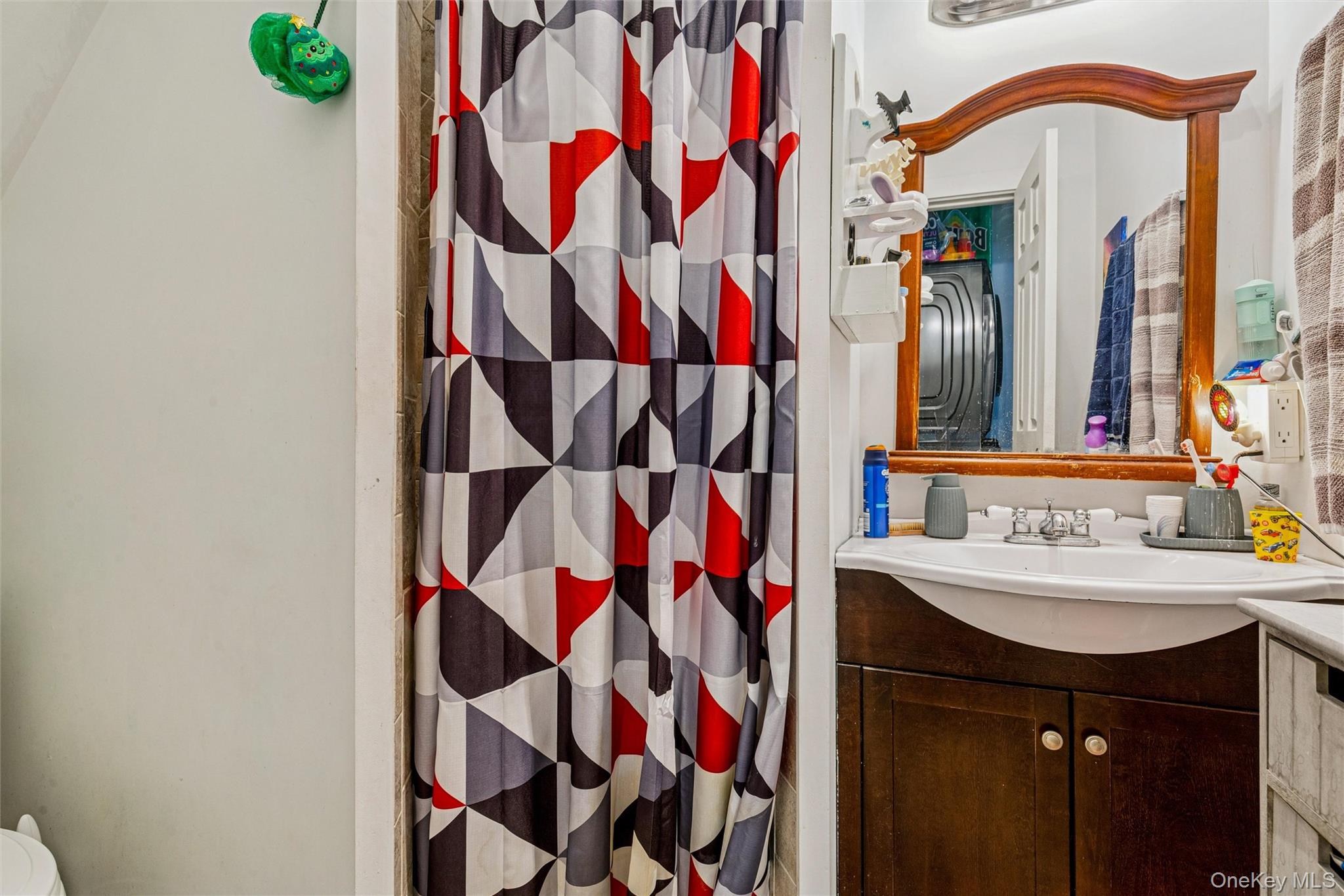 250 Main Road Riverhead, NY 11901 - Photo 5 of 31 a bathroom with a sink and a mirror