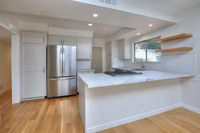 a kitchen with a stove and a sink