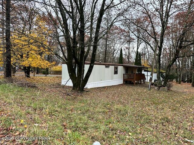 869 Toll Road Effort, PA 18330 - Photo 7 of 13 a view of outdoor space with deck and a garden