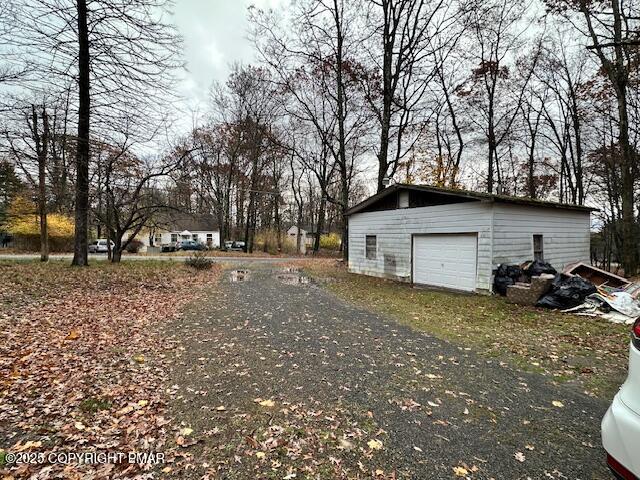 869 Toll Road Effort, PA 18330 - Photo 8 of 13 a view of a house with a back yard