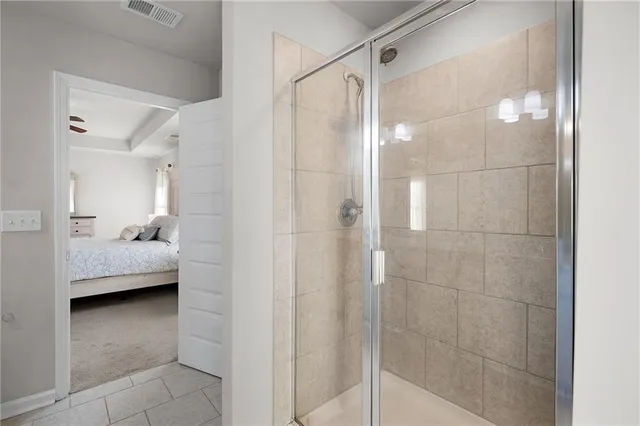 a bathroom with a shower and a sink