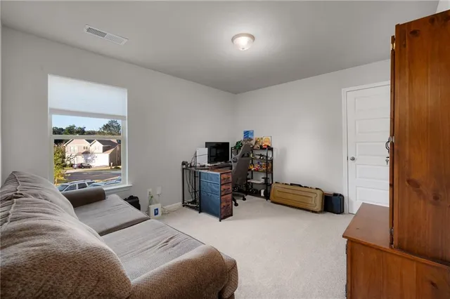 a bedroom with furniture and a couch