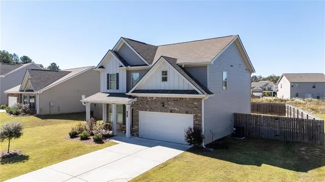 a front view of a house with yard