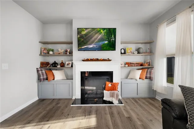 a living room with furniture and a fireplace