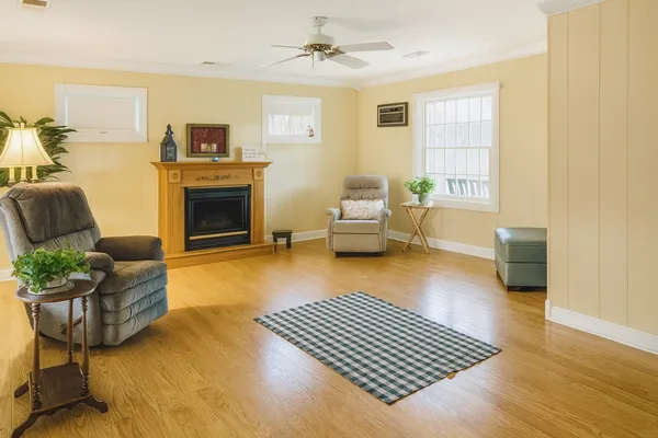 a living room with furniture rug and window