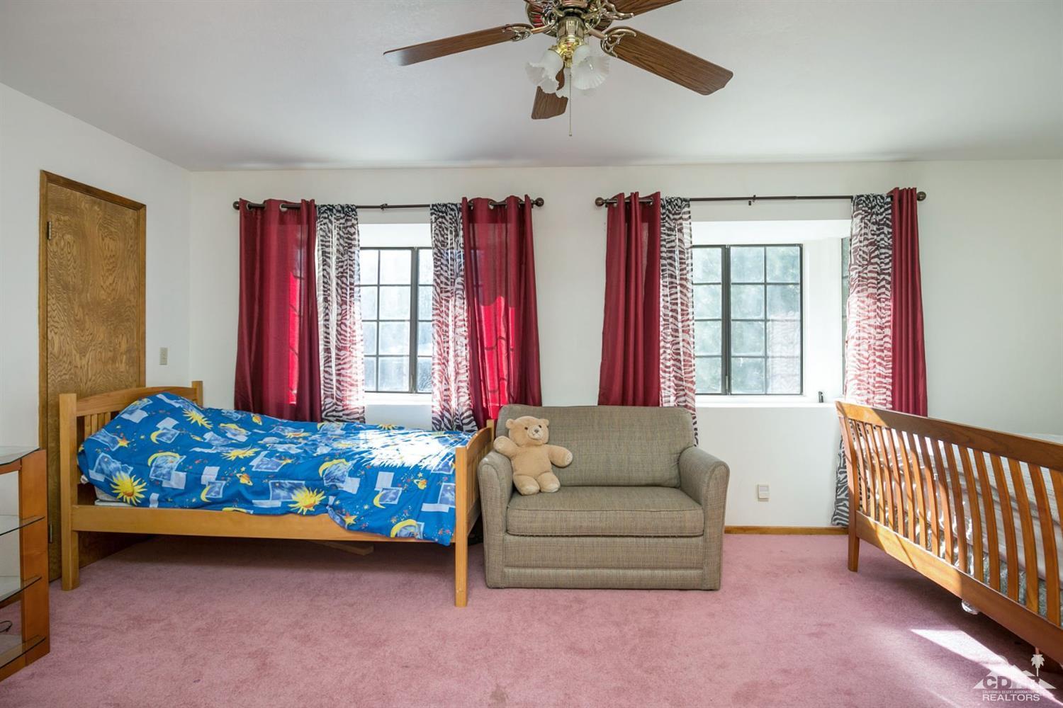 1740 Cascade Road Big Bear City, CA 92314 - Photo 22 of 31 a living room with furniture and windows