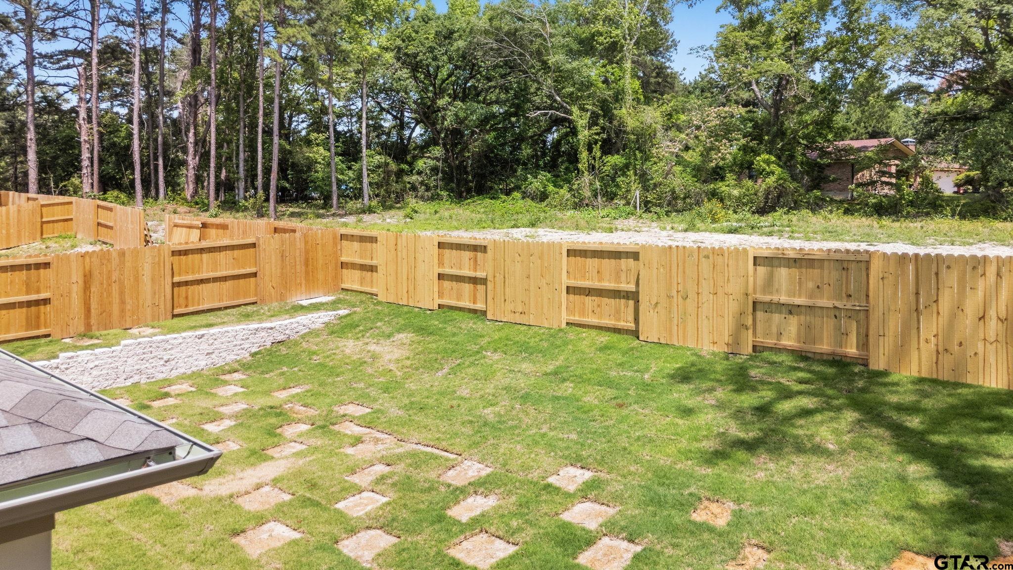 2968 Calloway Road Tyler, TX 75701 - Photo 21 of 24 a view of a backyard with chairs