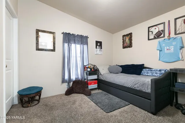 a living room with furniture and a toilet