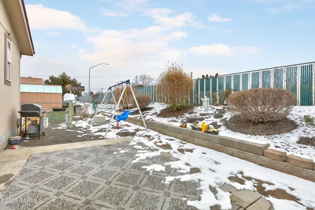 a view of a terrace with wooden fence