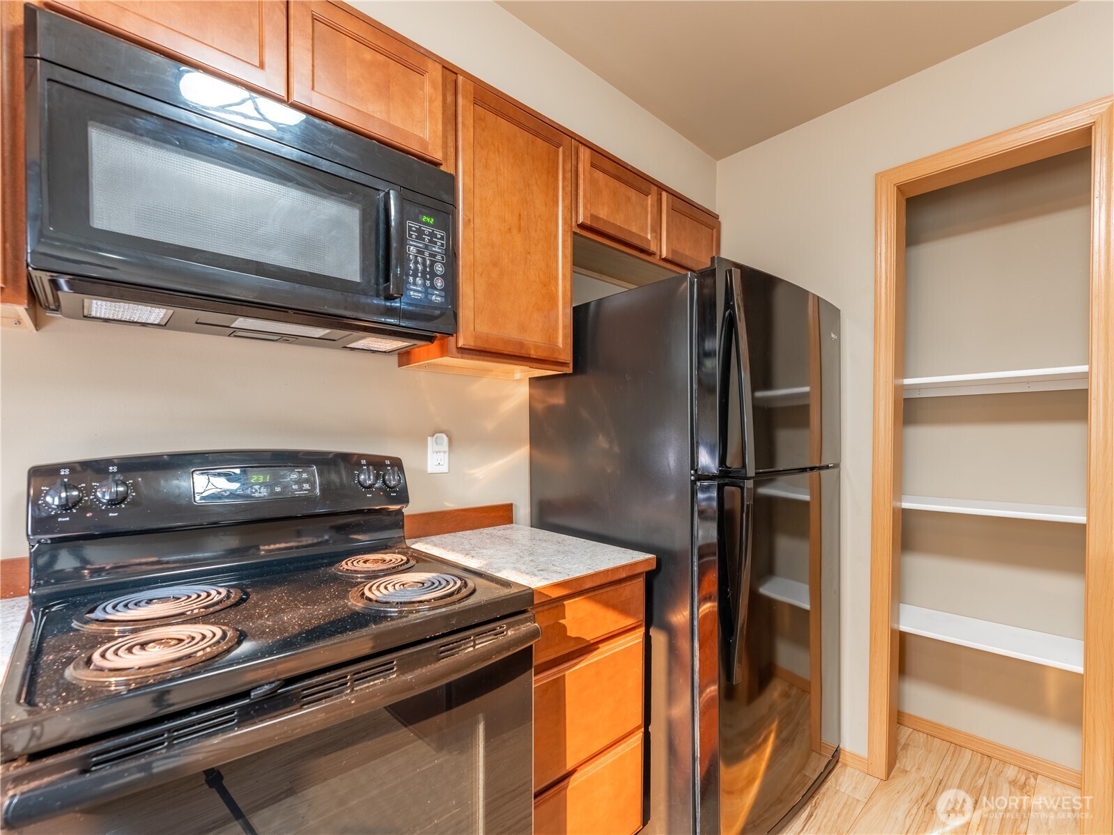 1535 Historic Lane Wenatchee, WA 98801 - Photo 12 of 35 a kitchen with a stove and a microwave