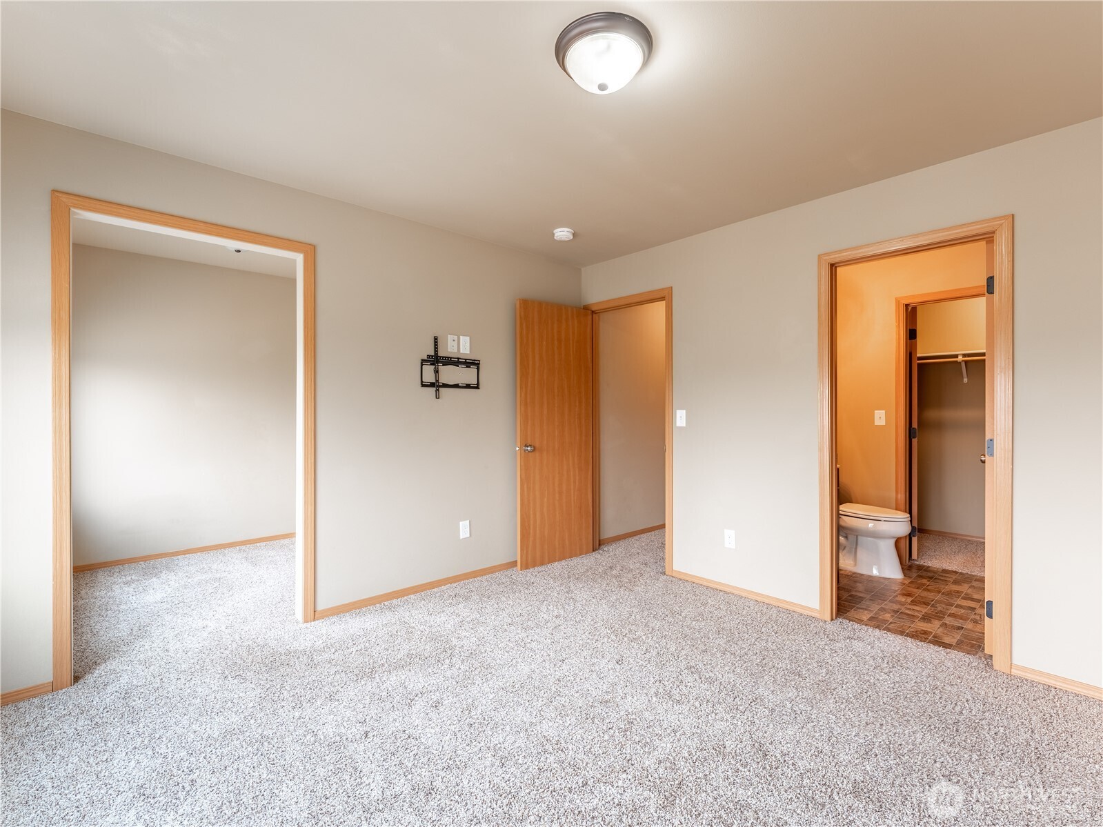 1535 Historic Lane Wenatchee, WA 98801 - Photo 5 of 35 an empty room with closet and wooden door
