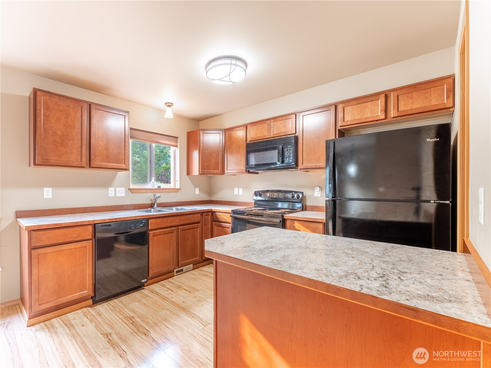 1535 Historic Lane Wenatchee, WA 98801 - Photo 8 of 35 a kitchen with stainless steel appliances granite countertop a sink stove microwave and refrigerator