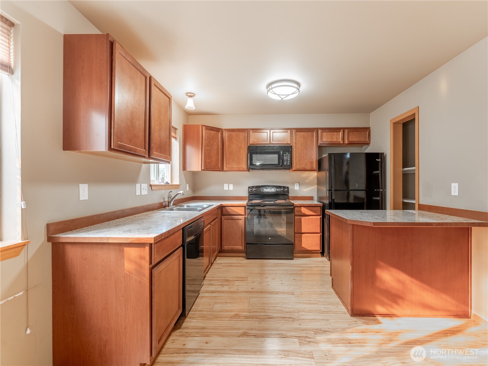 1535 Historic Lane Wenatchee, WA 98801 - Photo 9 of 35 a kitchen with stainless steel appliances granite countertop a stove top oven a sink dishwasher and a refrigerator