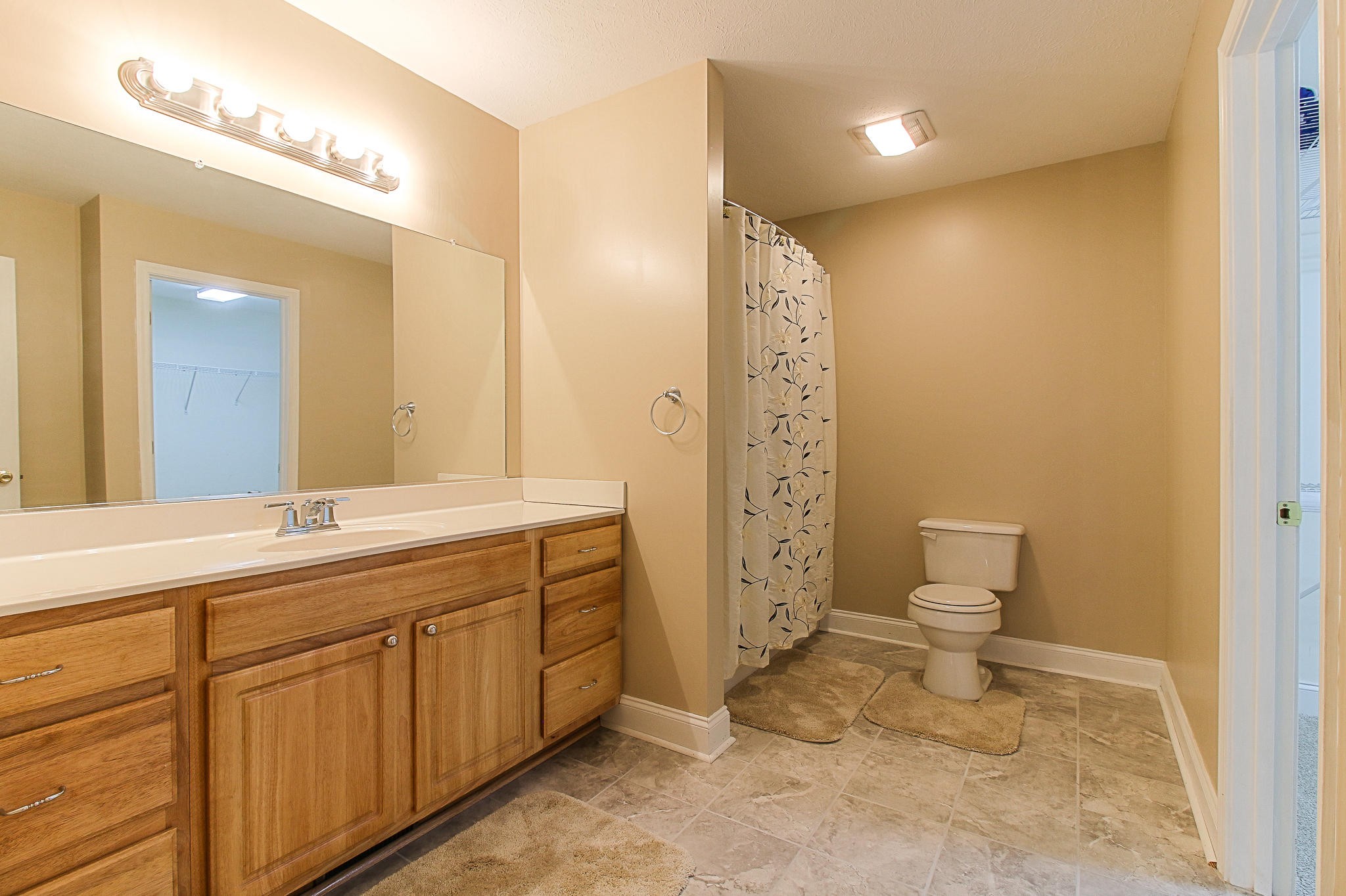 1973 Phagan Road Talbott, TN 37877 - Photo 16 of 35 a bathroom with a granite countertop sink mirror vanity and toilet