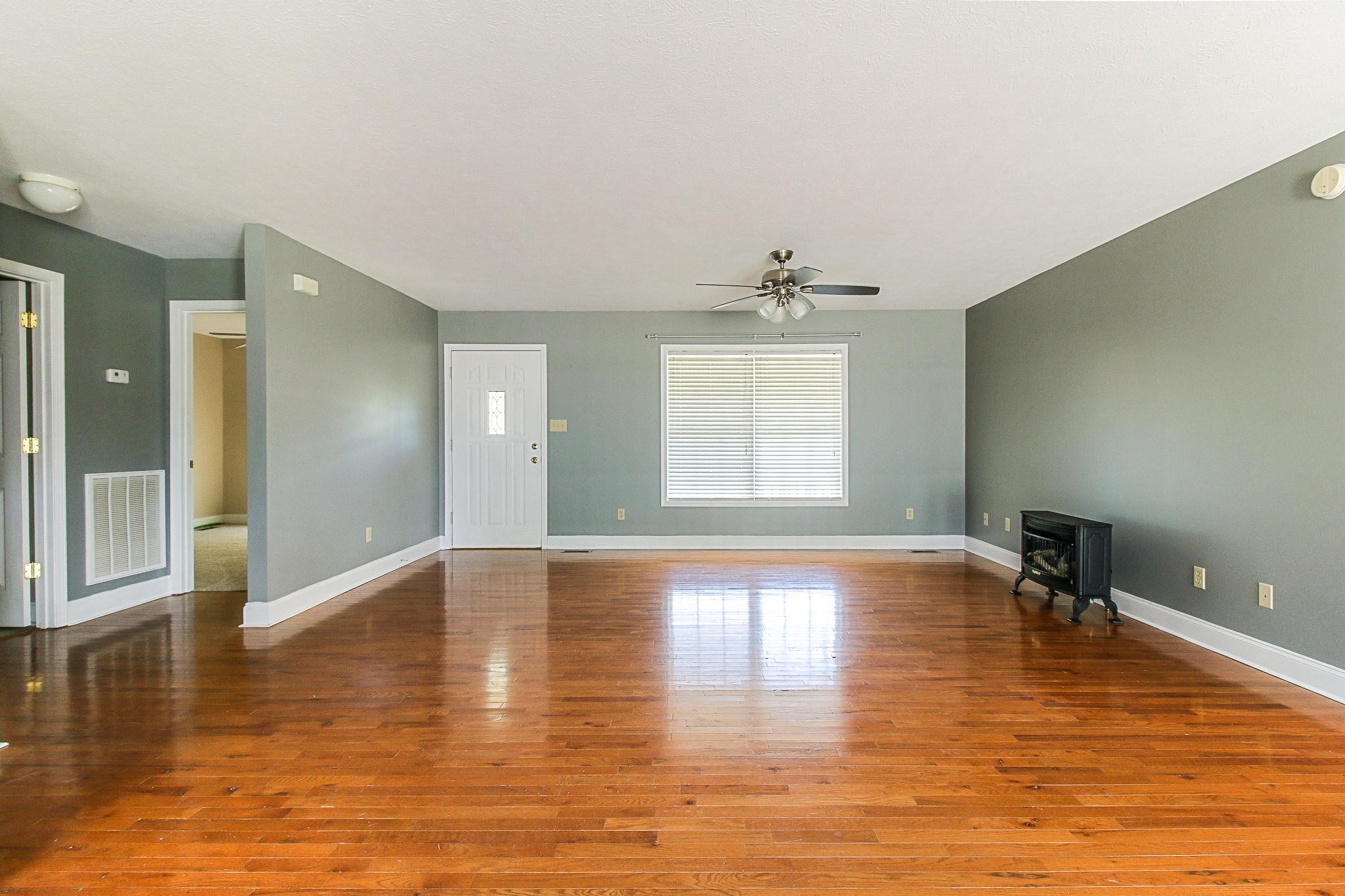 1973 Phagan Road Talbott, TN 37877 - Photo 7 of 35 a view of empty room with wooden floor and fan