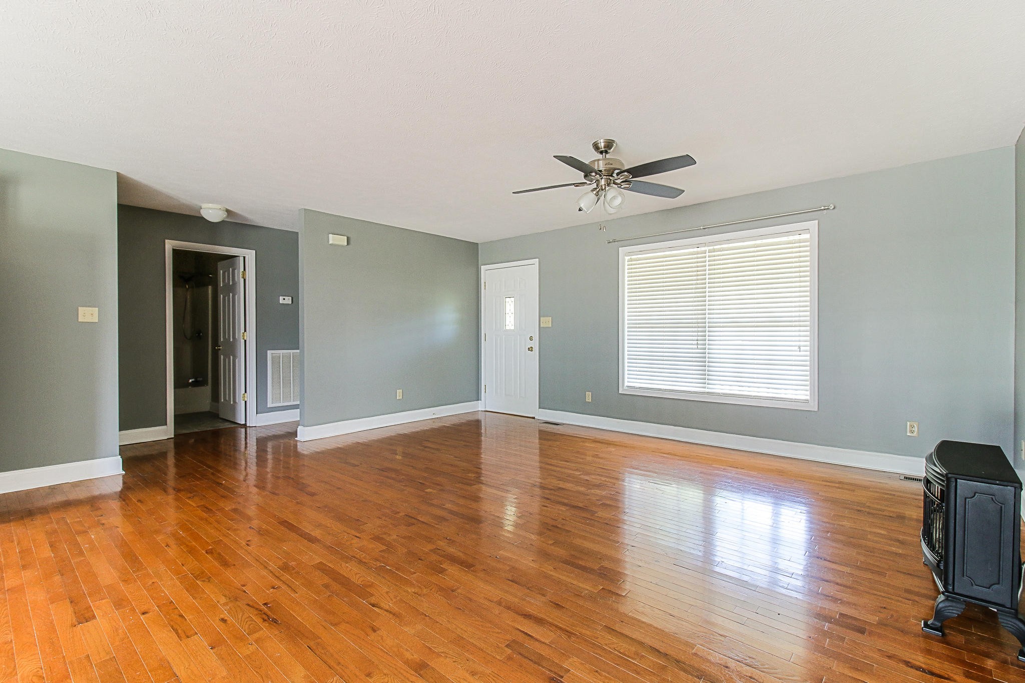 1973 Phagan Road Talbott, TN 37877 - Photo 8 of 35 a view of an empty room with window and wooden floor