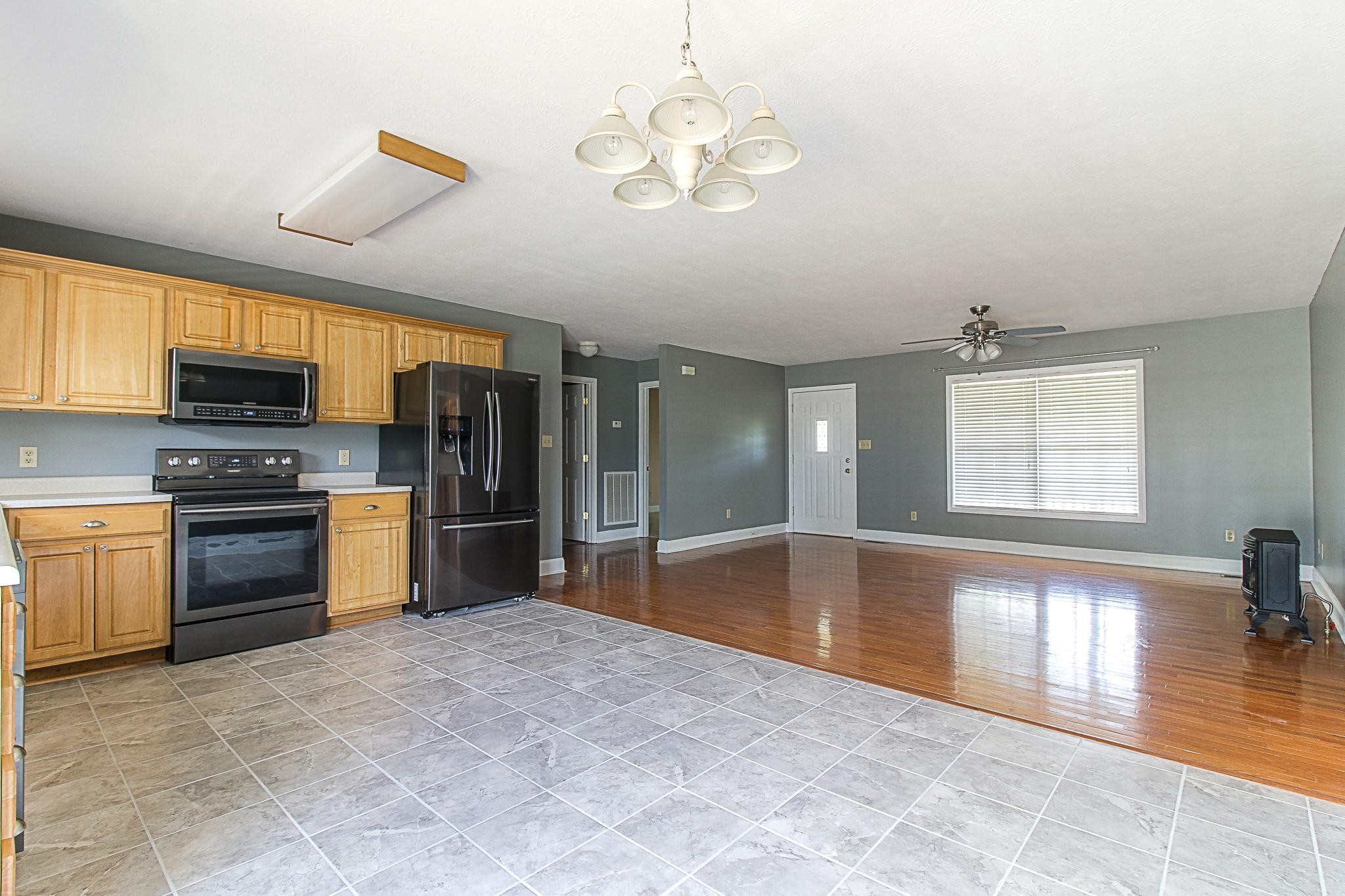 1973 Phagan Road Talbott, TN 37877 - Photo 10 of 35 a large kitchen with stainless steel appliances granite countertop a stove kitchen island a window and a refrigerator