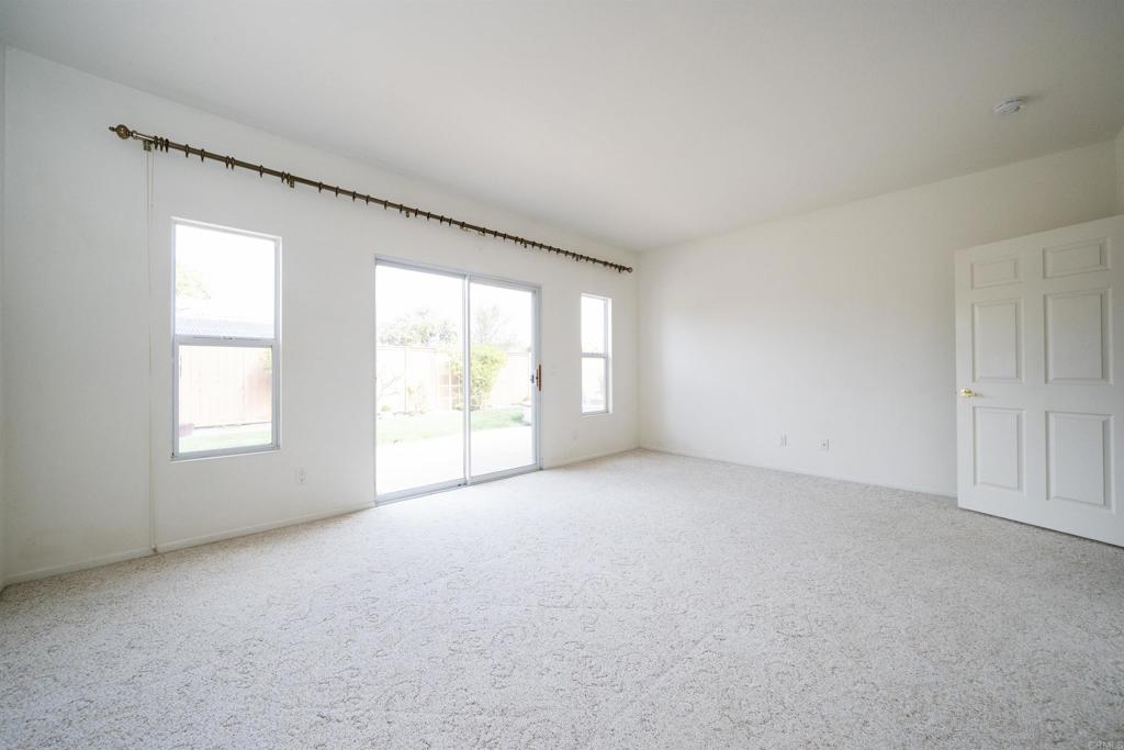 5210 Candlelight Street Oceanside, CA 92056 - Photo 16 of 30 an empty room with windows