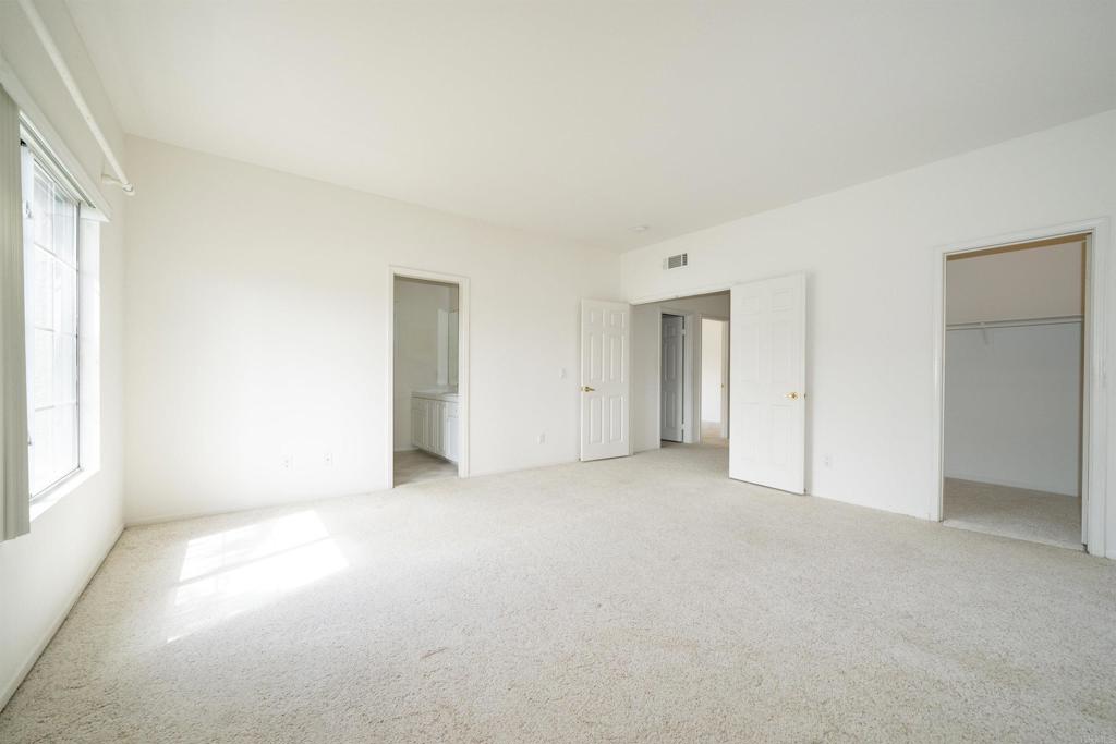5210 Candlelight Street Oceanside, CA 92056 - Photo 21 of 30 an empty room with windows and closet
