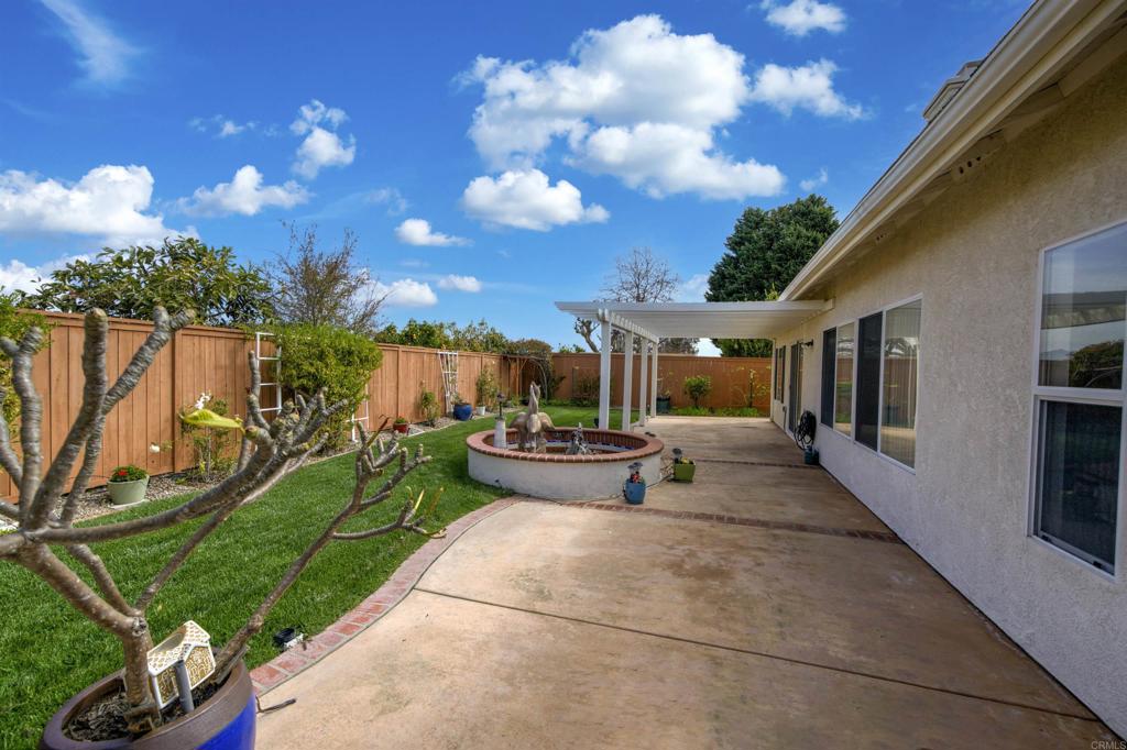 5210 Candlelight Street Oceanside, CA 92056 - Photo 26 of 30 a view of a house with backyard porch and sitting area