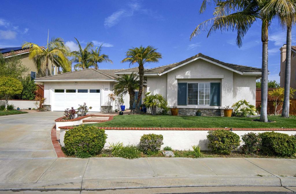 5210 Candlelight Street Oceanside, CA 92056 - Photo 28 of 30 a front view of a house with a yard