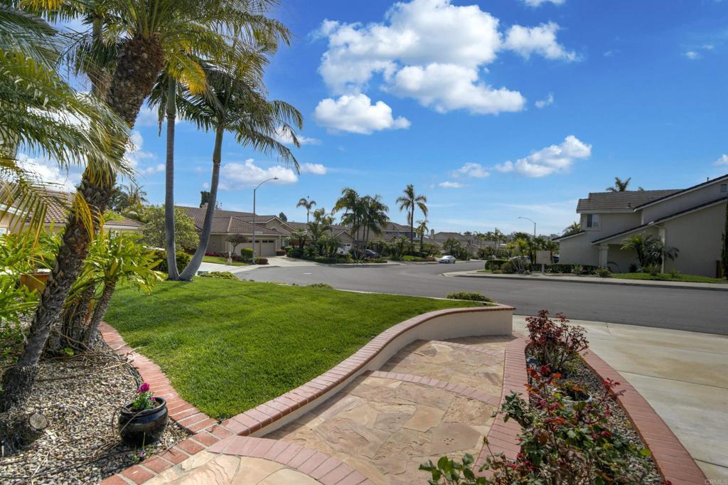 5210 Candlelight Street Oceanside, CA 92056 - Photo 29 of 30 a view of a garden with swimming pool