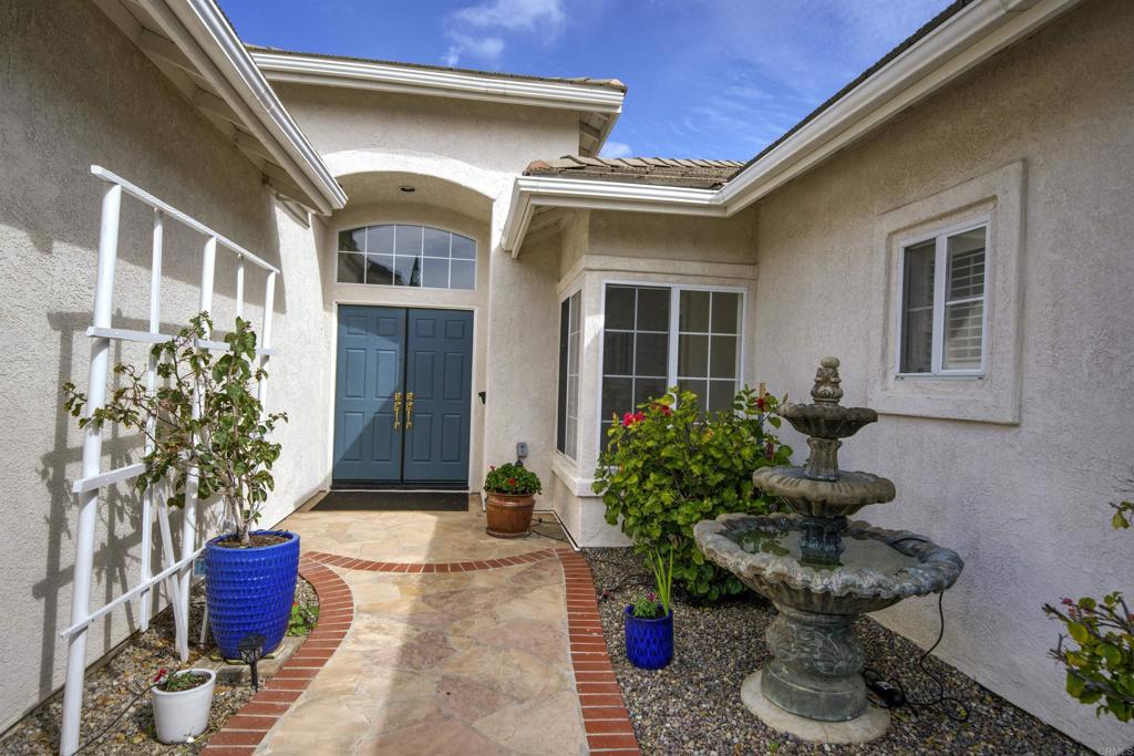 5210 Candlelight Street Oceanside, CA 92056 - Photo 3 of 30 a view of a house with potted plants