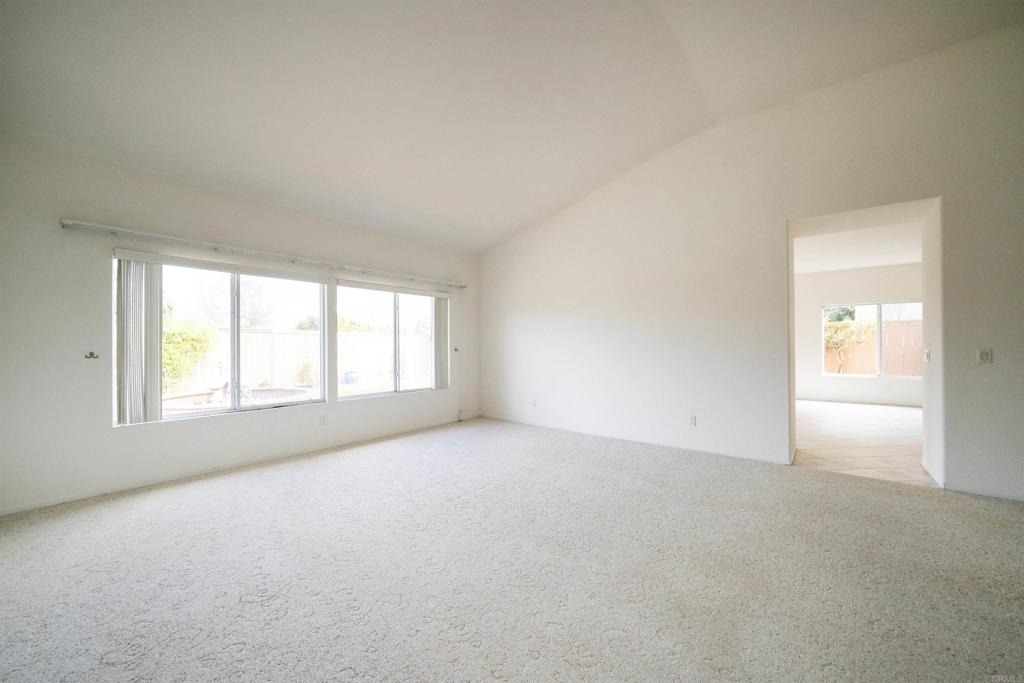 5210 Candlelight Street Oceanside, CA 92056 - Photo 4 of 30 an empty room with windows and closet
