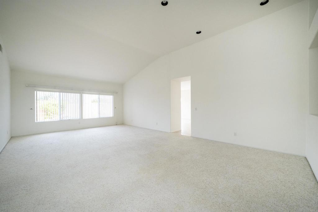 5210 Candlelight Street Oceanside, CA 92056 - Photo 5 of 30 a view of an empty room with a window
