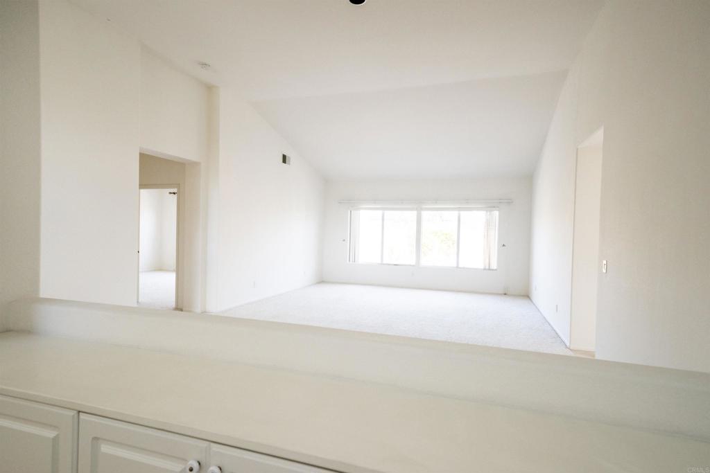 5210 Candlelight Street Oceanside, CA 92056 - Photo 8 of 30 a view of an empty room with a window