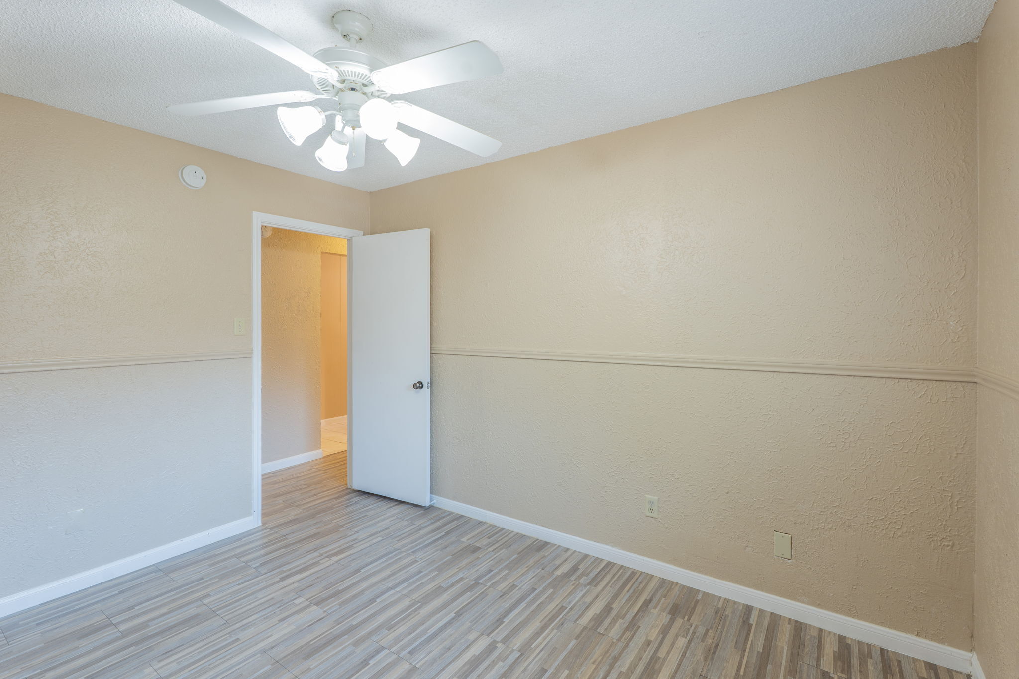 5628 Wagon Train Road Austin, TX 78749 - Photo 20 of 26 Durable tile flooring and classic chair rail molding define this versatile living space.