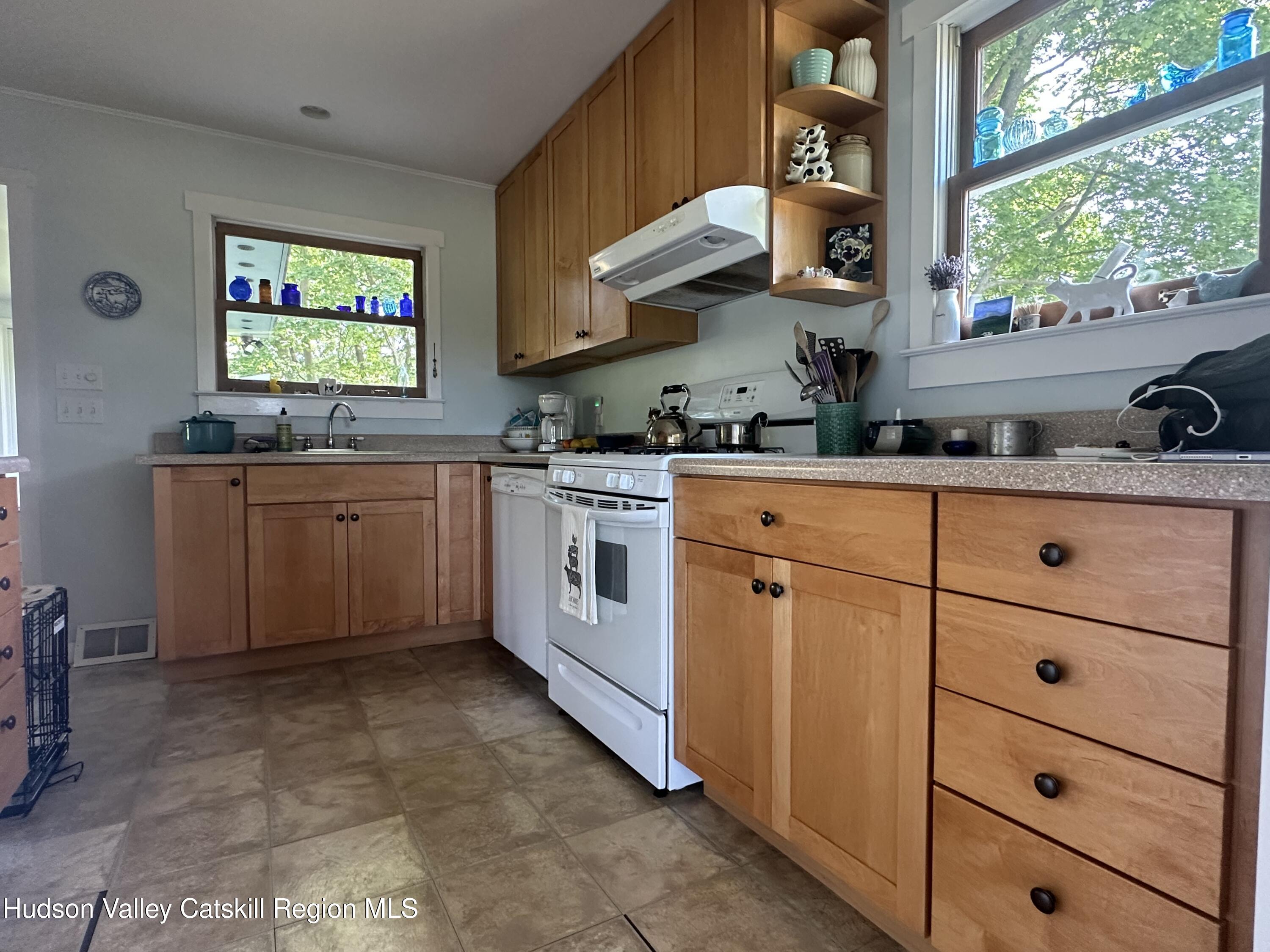 1492 County Road Copake, NY 12516 - Photo 4 of 34 a kitchen with stainless steel appliances a stove a sink and a refrigerator