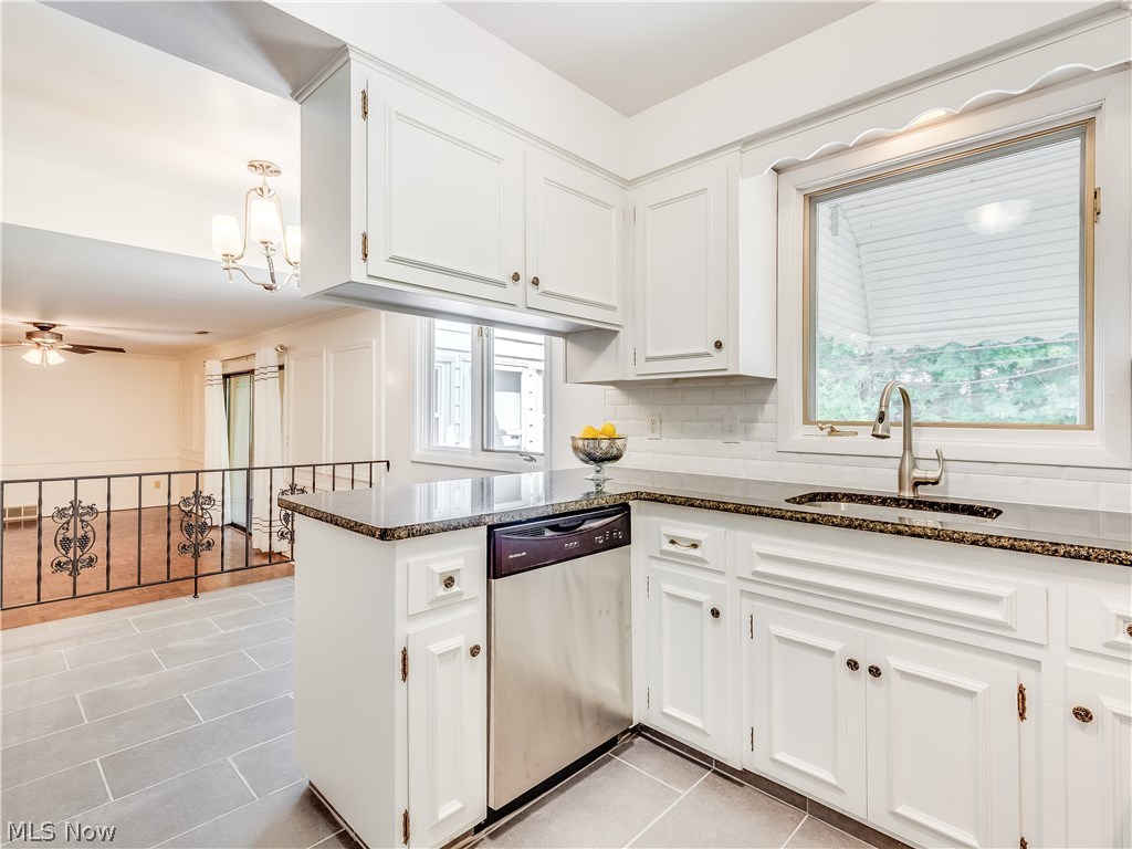 1047 Roland Road Lyndhurst, OH 44124 - Photo 7 of 26 Eat-In kitchen features a breakfast area and opens up to the family room with parquet wood flooring.