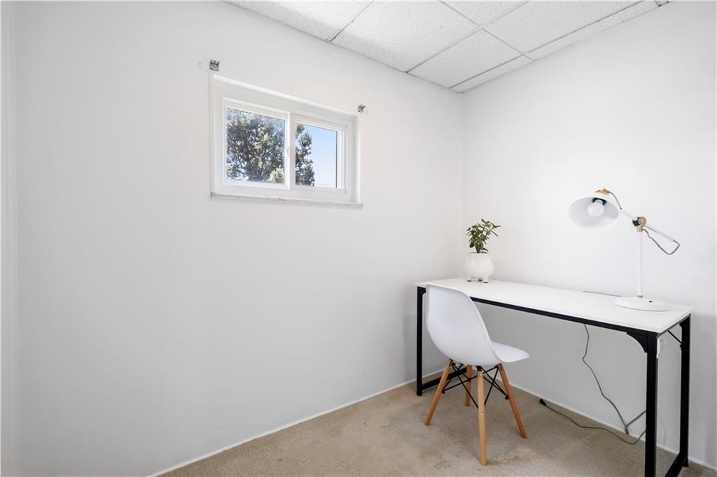 4088 Howley Street Pittsburgh, PA 15224 - Photo 21 of 32 a workspace with furniture and a potted plant