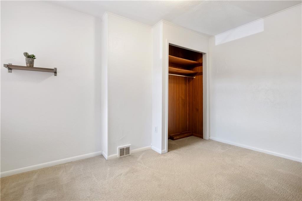 4088 Howley Street Pittsburgh, PA 15224 - Photo 22 of 32 an empty room with closet and a window