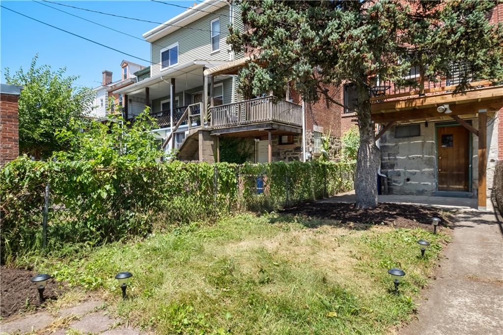 4088 Howley Street Pittsburgh, PA 15224 - Photo 25 of 32 a view of a house with brick walls and plants