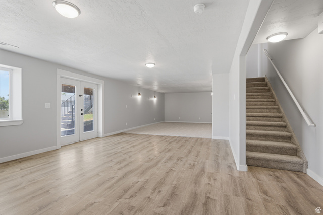 1252 Skyline Road Saratoga Springs, UT 84045 - Photo 33 of 51 Spacious room featuring wood-finish flooring, light grey walls, and recessed lighting