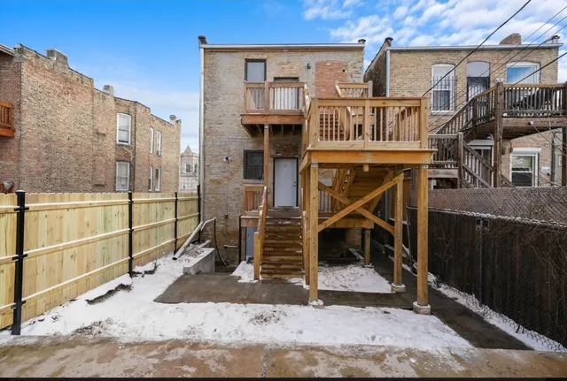 a view of a balcony and front door
