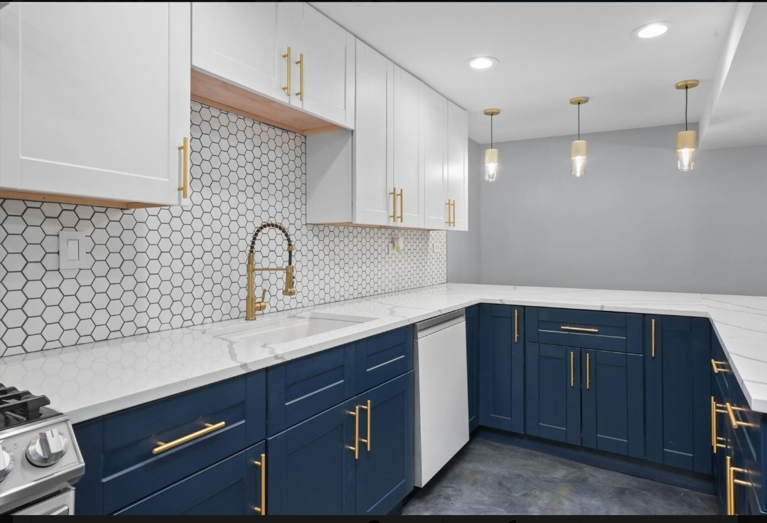 1526 South St Louis Avenue, Unit G Chicago, IL 60623 - Photo 4 of 13 a kitchen with a sink and cabinets