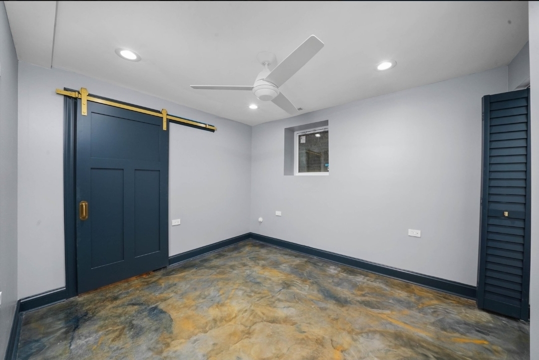 1526 South St Louis Avenue, Unit G Chicago, IL 60623 - Photo 9 of 13 an empty room with closet and windows