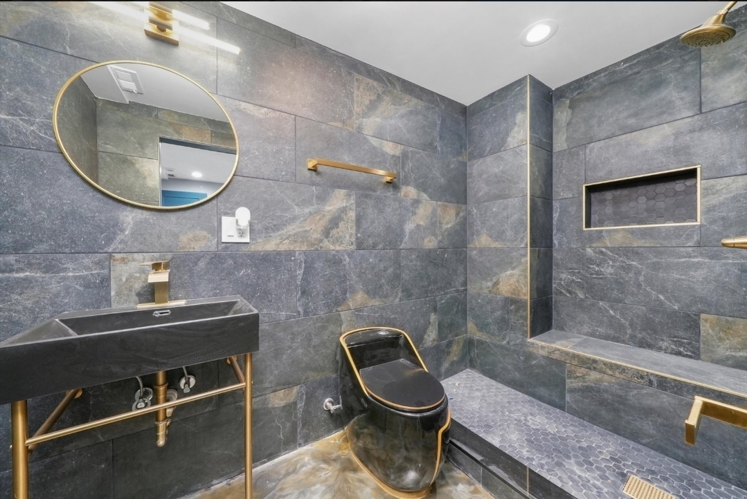 1526 South St Louis Avenue, Unit G Chicago, IL 60623 - Photo 10 of 13 a bathroom with a toilet a sink and mirror