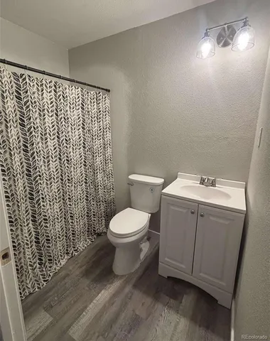 a white toilet sitting next to a bathroom sink