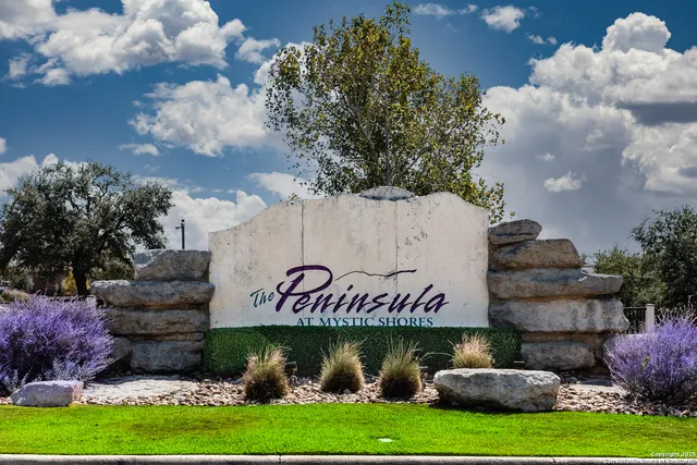 a sign that is sitting on a brick wall