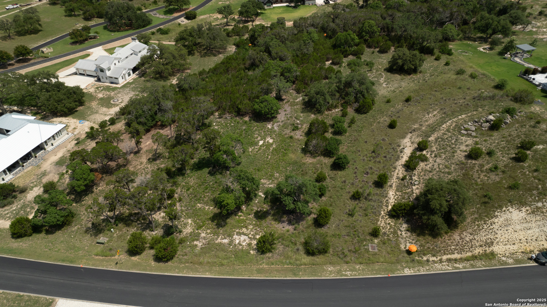 161 Puzzle Pass Spring Branch, TX 78070 - Photo 14 of 18 a view of a yard with a wooden fence