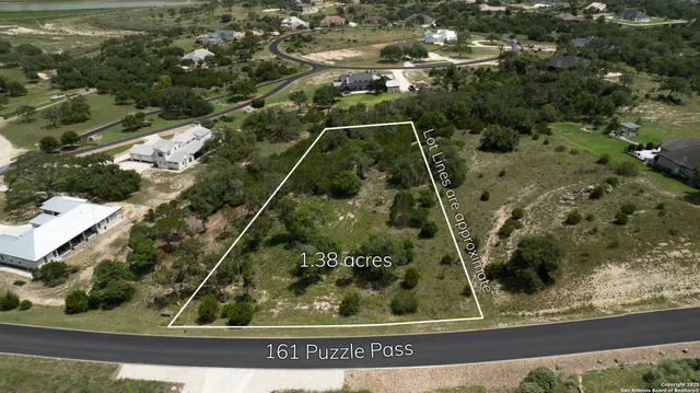 a aerial view of a houses with yard