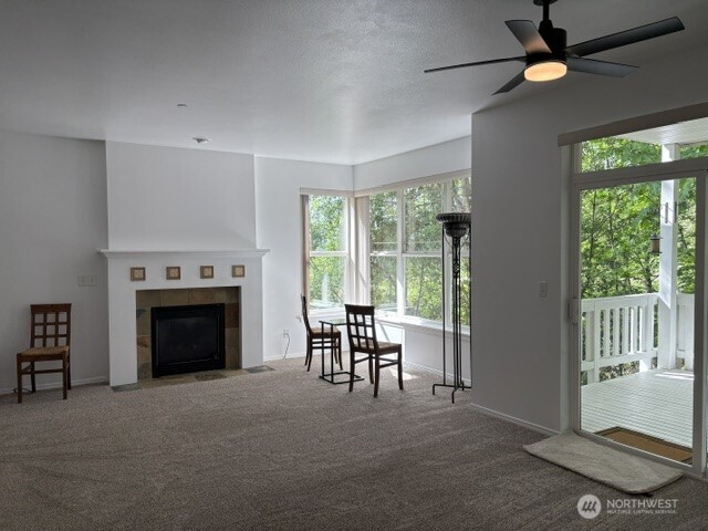 714 228th Street Southwest, Unit O101 Bothell, WA 98021 - Photo 8 of 28 a view of livingroom with furniture fireplace and window