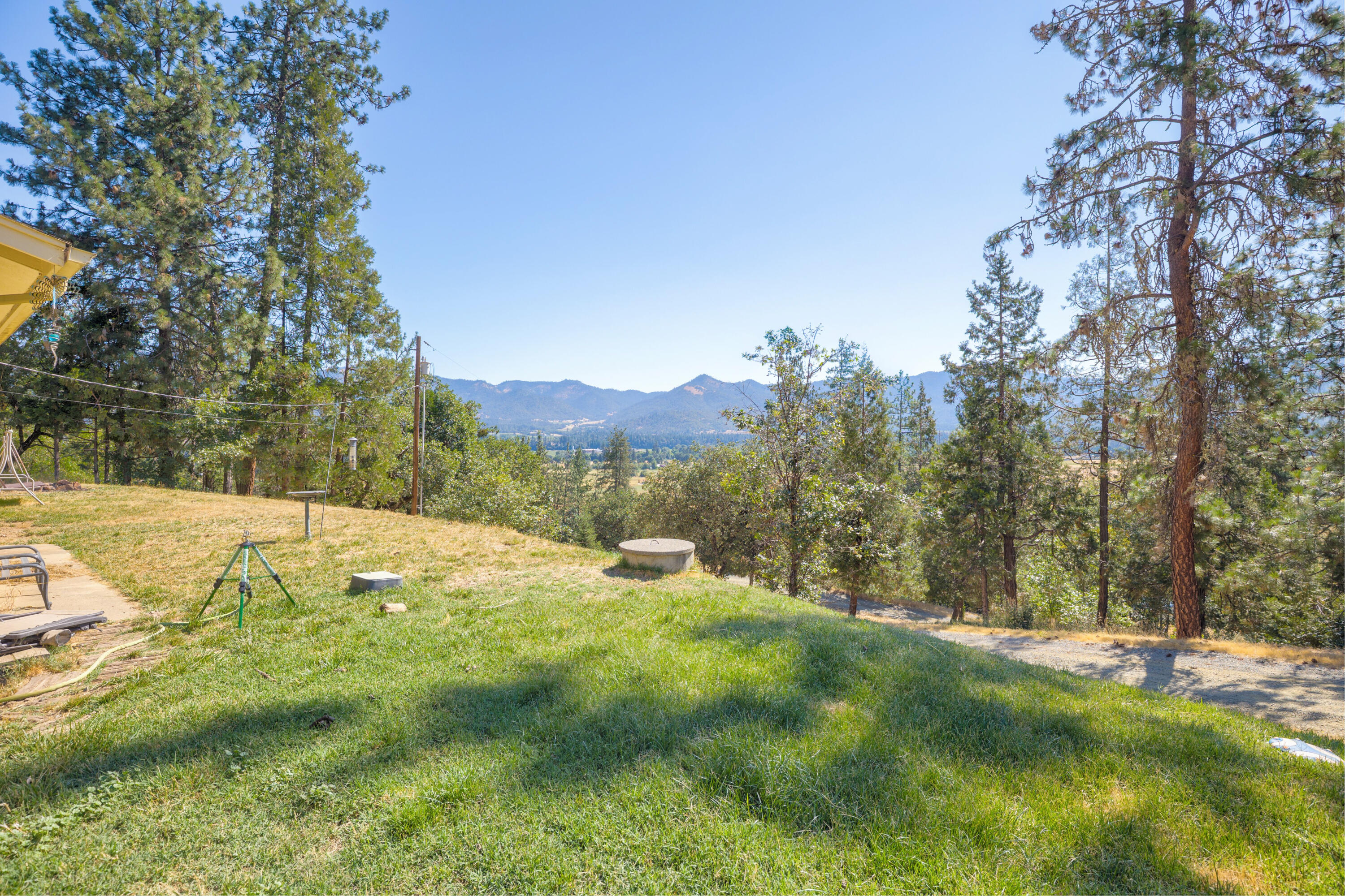 12748 Water Gap Road Williams, OR 97544 - Photo 2 of 35 a view of a yard with trees