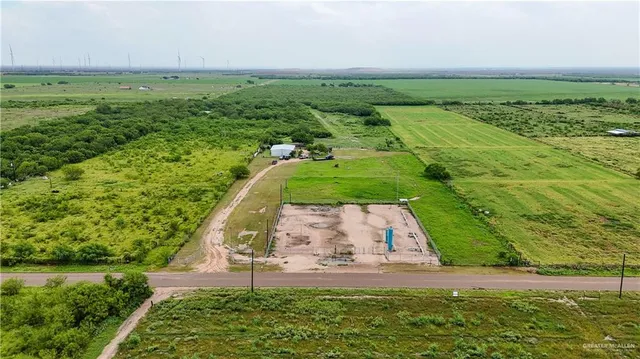 a view of a field with an outdoor space