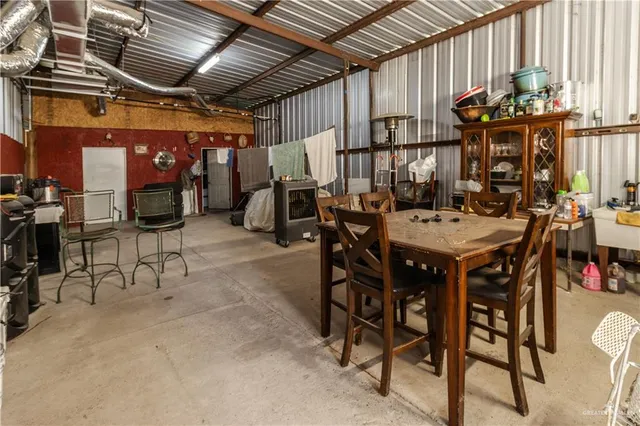 a view of a dinning table and chairs in the patio