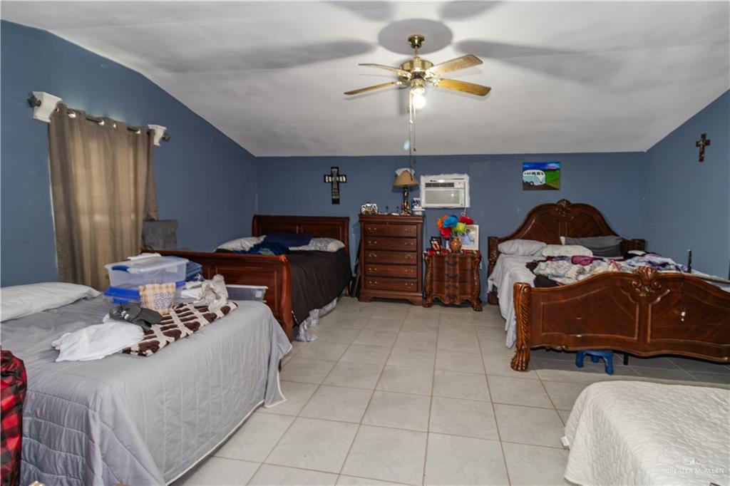 24724 Iowa Road Edinburg, TX 78541 - Photo 6 of 18 a living room with furniture and a chandelier